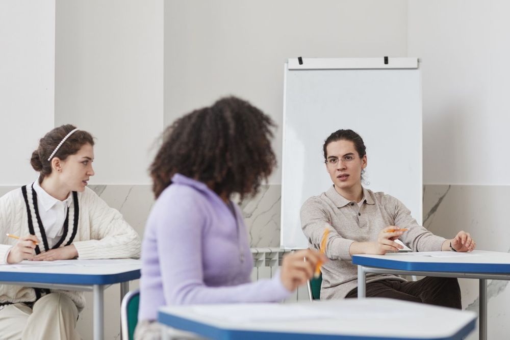 Students talking together in a classroom